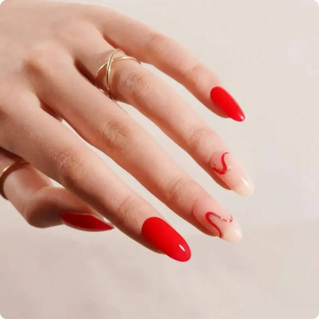 Nude-and-red wave nail design with glossy shine; curved red swirls on clear pink.