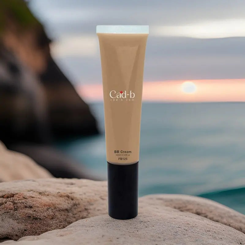BB cream tube, beige cream with black base and cap