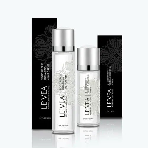 Night Repair Cream + Vitamin C Serum trio with black cartons and silver caps