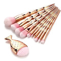 Mermaid fishtail-shaped brush with pink bristles and diamond-pattern rose-gold handle