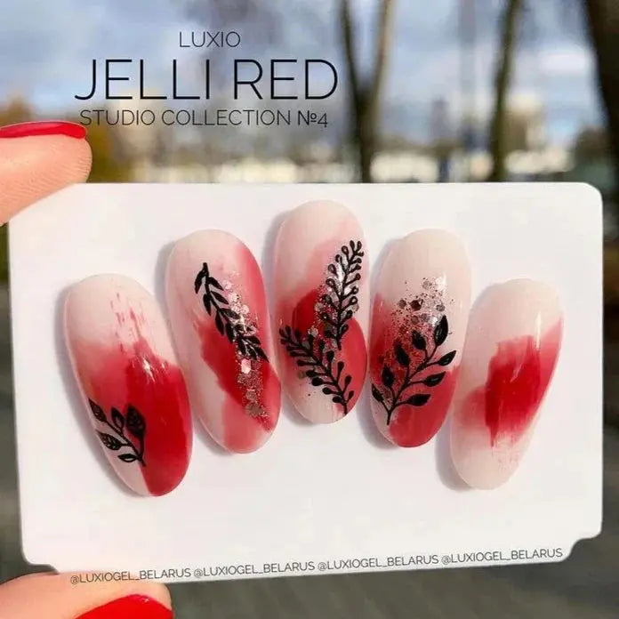 Deep red Jelli nail gel swatch cards with dark floral nail art