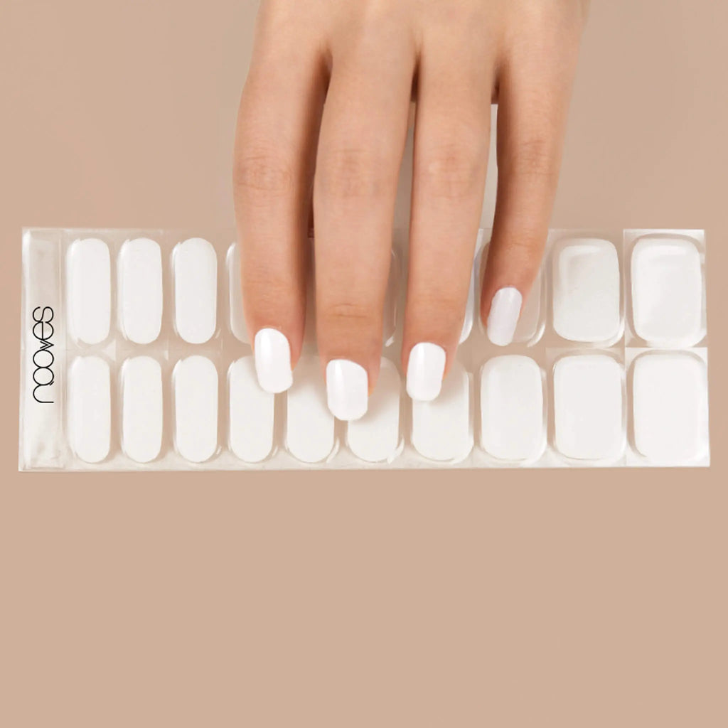 Gel nail strips sheet with multiple white oval nail sizes and NOOVES logo