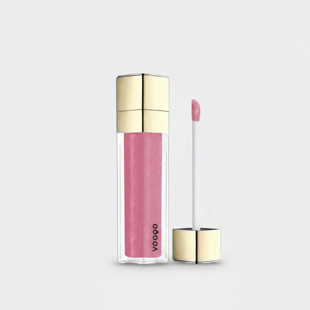 Lip Gloss Spicy Berry: pink shimmery gloss with wand in gold-toned cap and clear tube