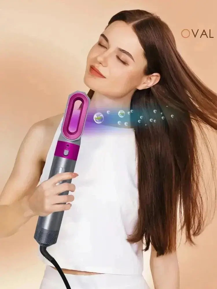 Purple-and-silver multi hair styler in hand with airflow vent and power button panel
