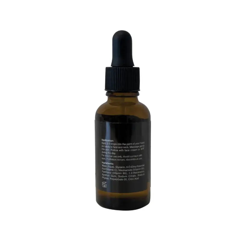 Niacinamide Vitamin Boost Serum bottle back view with ingredient text and black cap