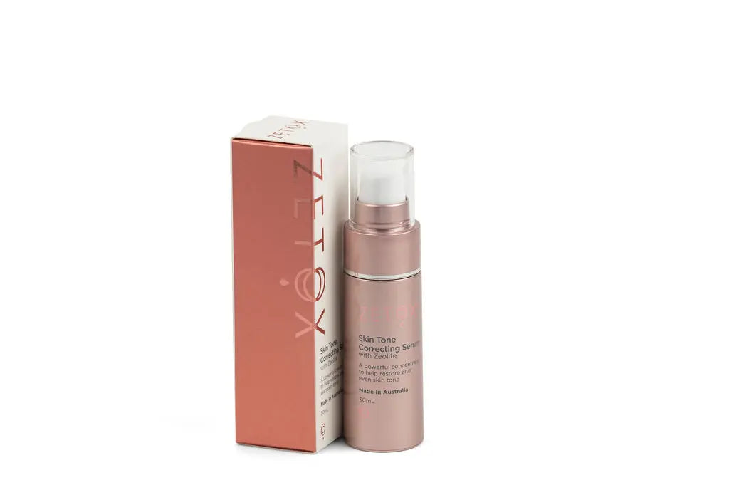 Zetox skin tone correcting serum 30ml bottle beside product box, rose-gold
