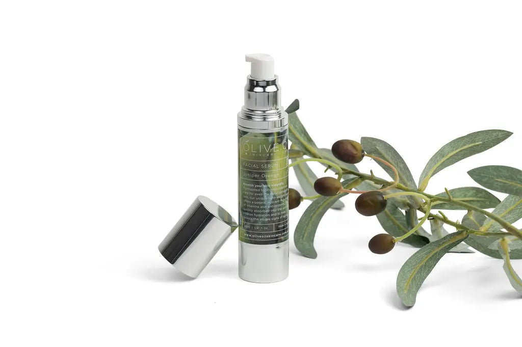 Facial serum Juniper Orange, 40 ml pump bottle with leafy sprig