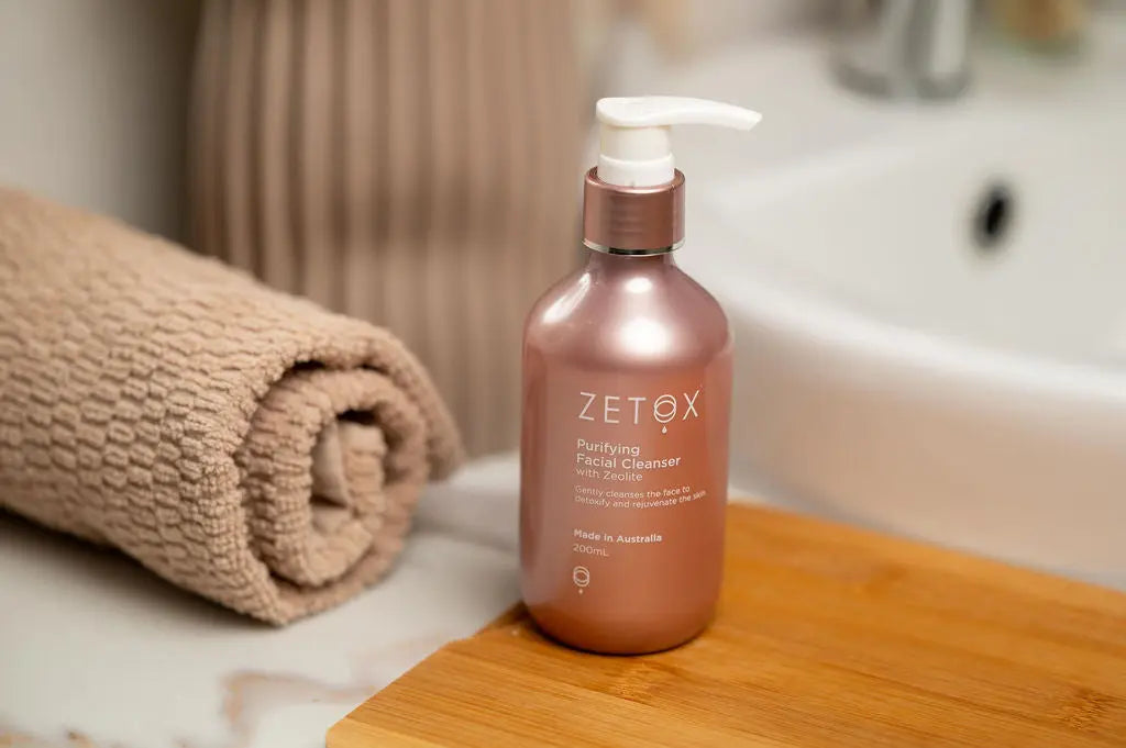 Zetox Purifying Facial Cleanser pump bottle with rolled towel
