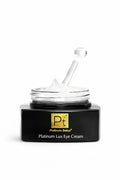Platinum Lux Eye Cream jar with gold Pт logo, black base, open lid