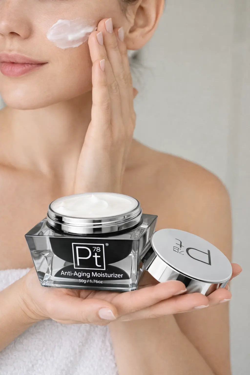 Anti-aging moisturizer jar with open lid, white cream visible on top