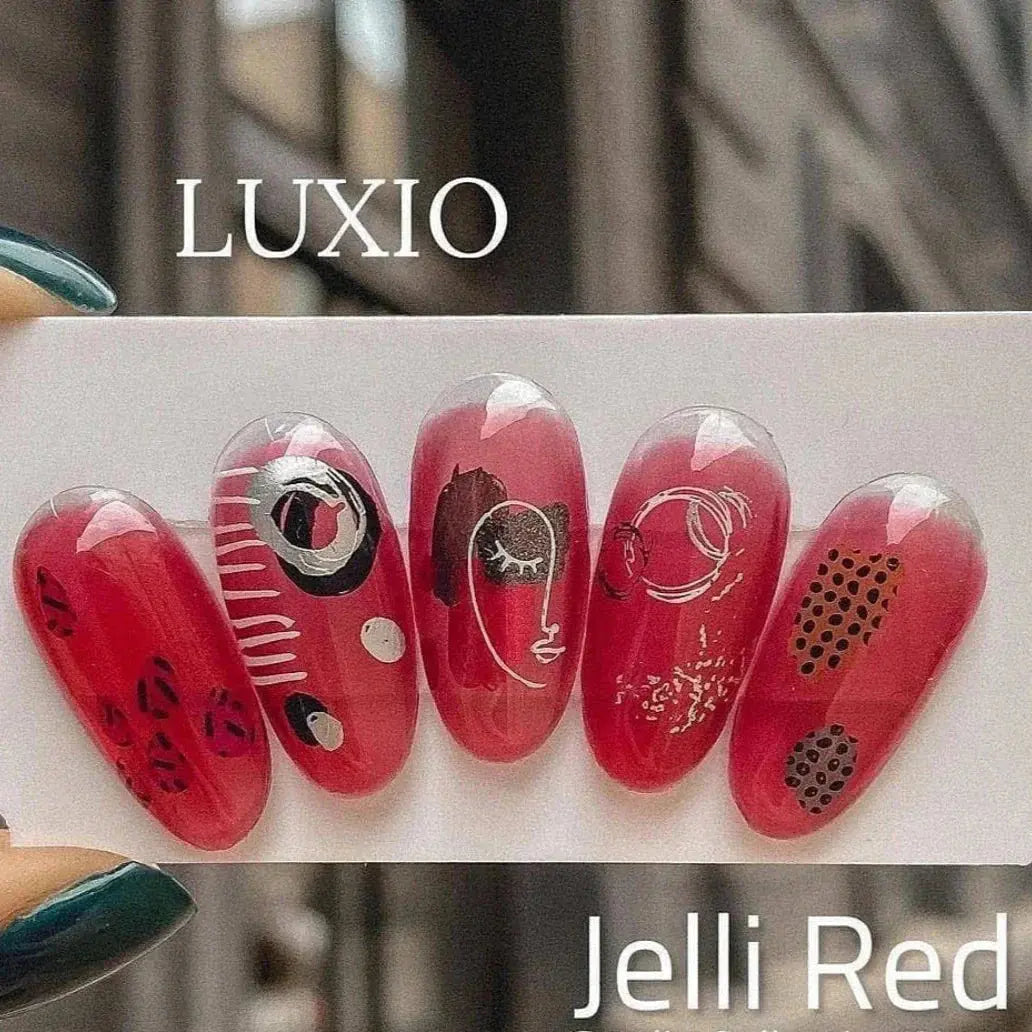 Deep red Jelli nail gel swatches with dark abstract line art