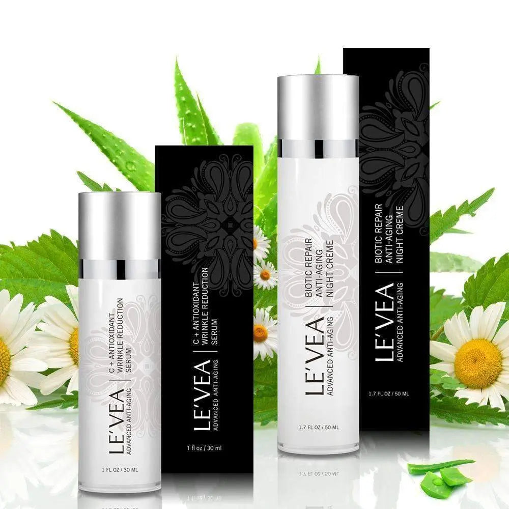Night Repair Cream + Vitamin C Serum bottles with black cartons and pump-style caps