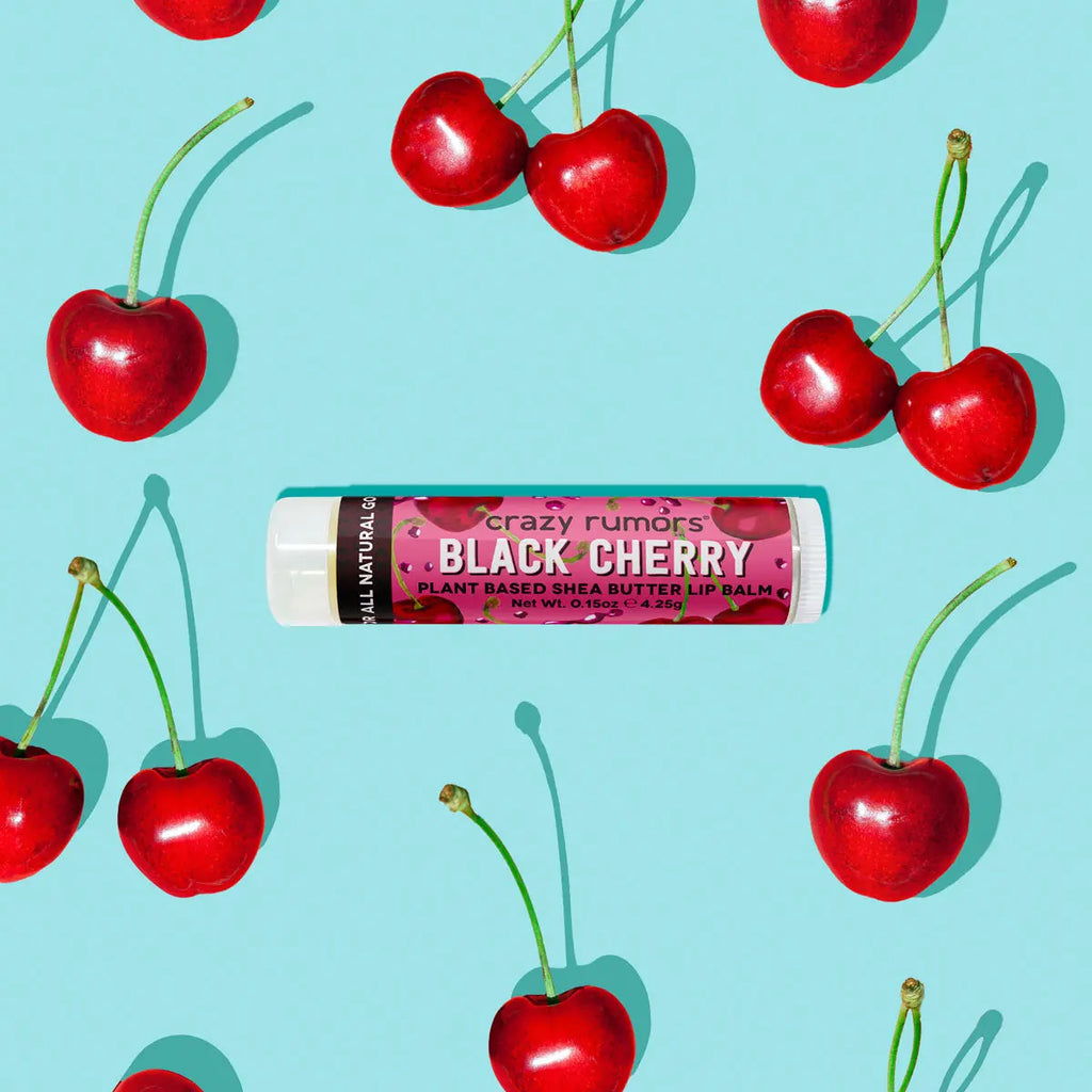 Black Cherry lip balm tube with red cherries scattered around