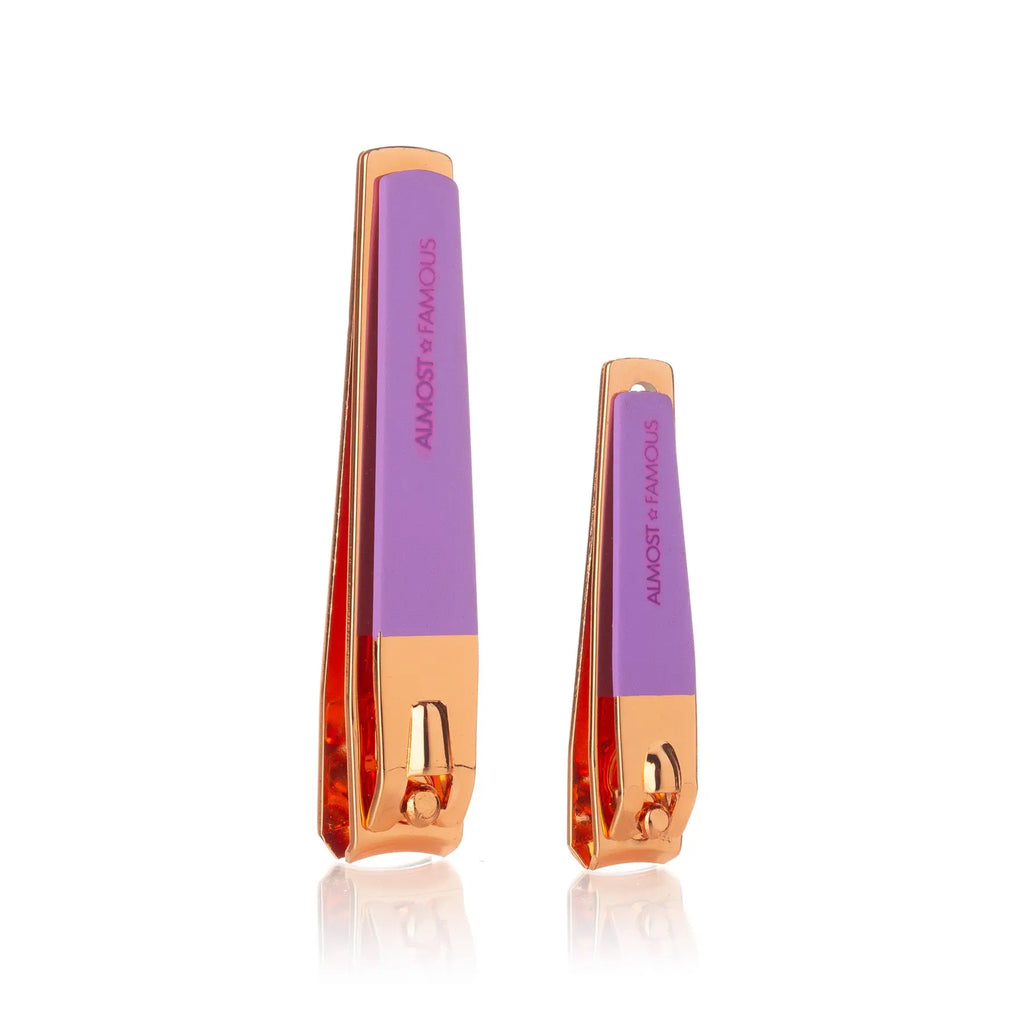 Pair nail clippers: rose-gold blades with purple handles, side view