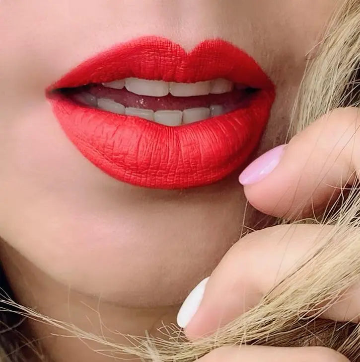 Orange-red matte lipstick on lips, soft matte texture