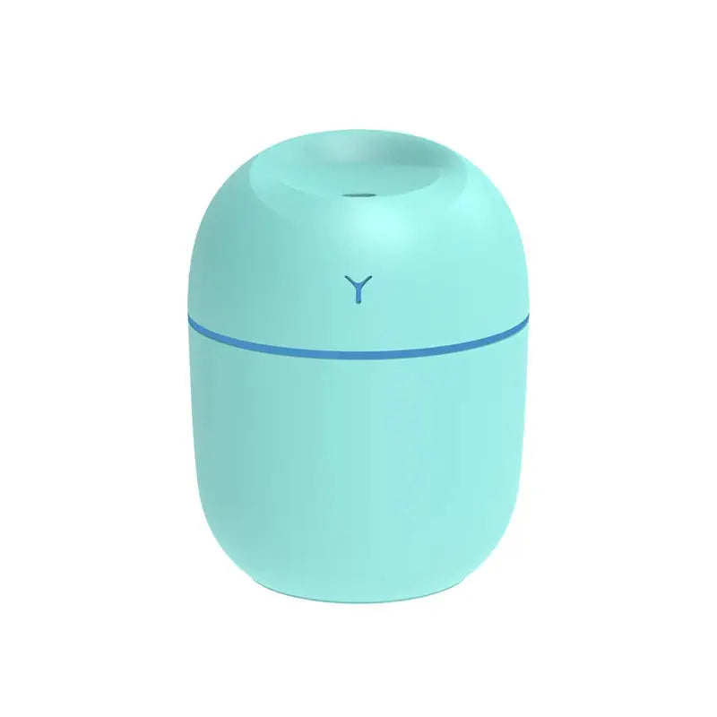 Teal portable ultrasonic aroma diffuser humidifier with LED ring and nozzle opening.