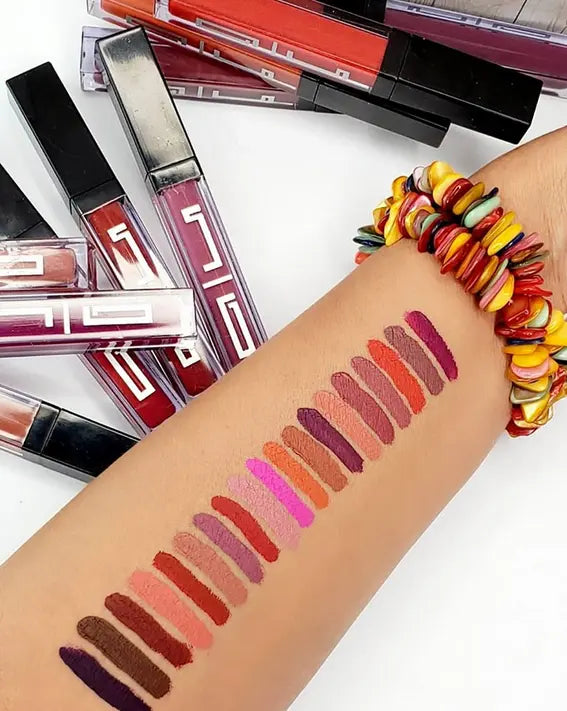 Matte liquid lipstick swatches on arm, mauve to deep berry tones