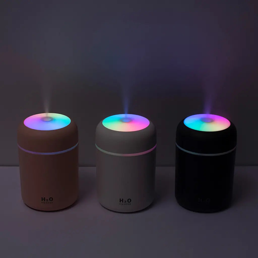 Humidifier aroma diffuser trio in dark tones with rainbow top lights