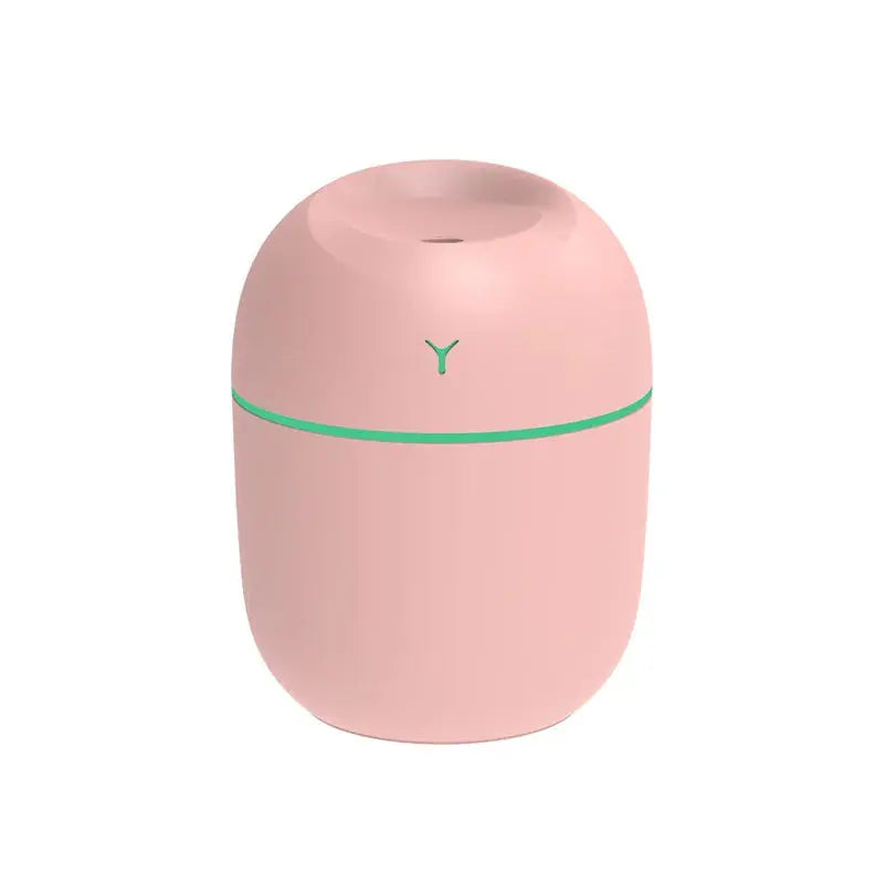Pink portable ultrasonic aroma diffuser humidifier with LED ring and mist opening.