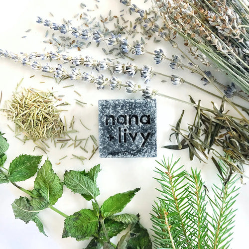 Charcoal mint salt block, dark speckled stone with centered embossed branding