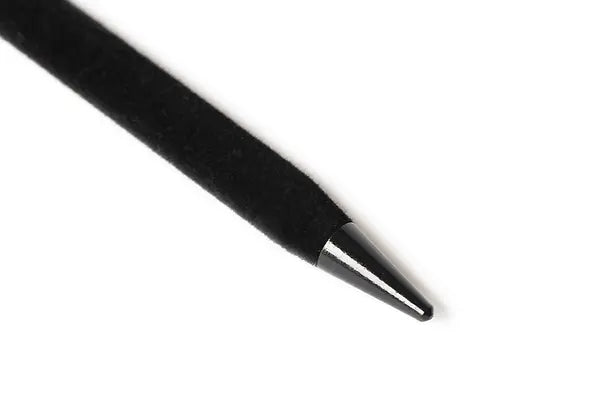 Black velvet hairstick with pointed tip, close-up