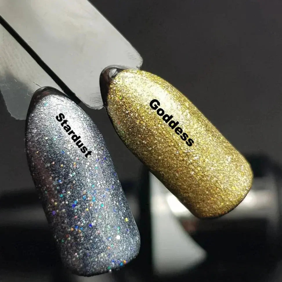 Pair of glitter nail swatches: Stardust (dark) and Goddess (gold)