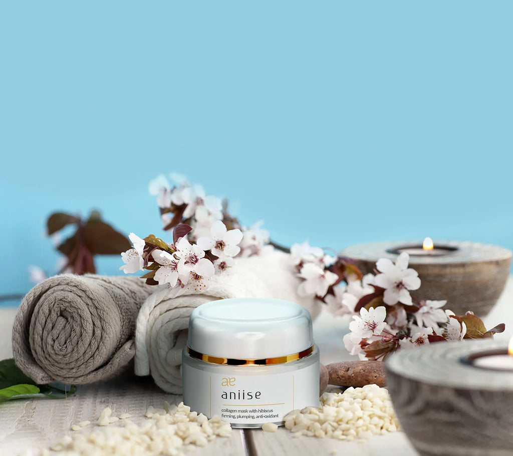Collagen facial mask with hibiscus jar, white container with gold-lidded top