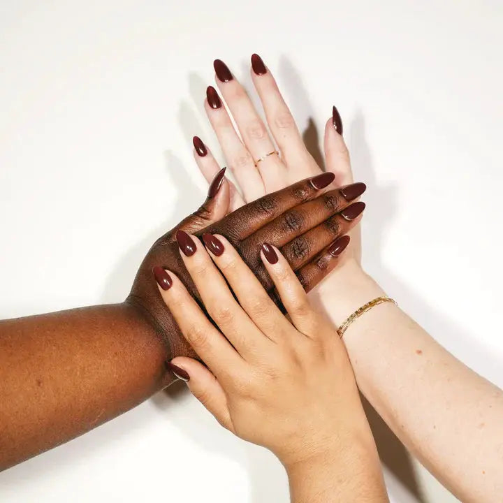 Hands wearing Hot Cocoa NT-34 dark brown glossy nails