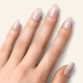 Natural nude gel nail strips on five fingers, glossy short oval nails