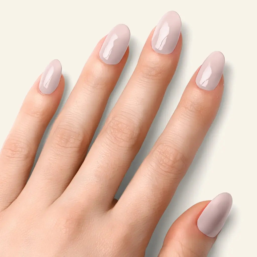 Natural nude gel nail strips on five fingers, glossy short oval nails